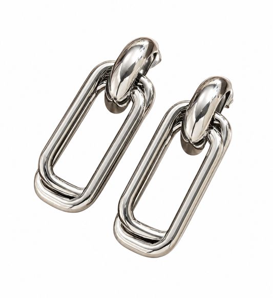 Oversized silver chunky double rectangular multi-strand link drop earrings with polished knot connector, displayed on white background.