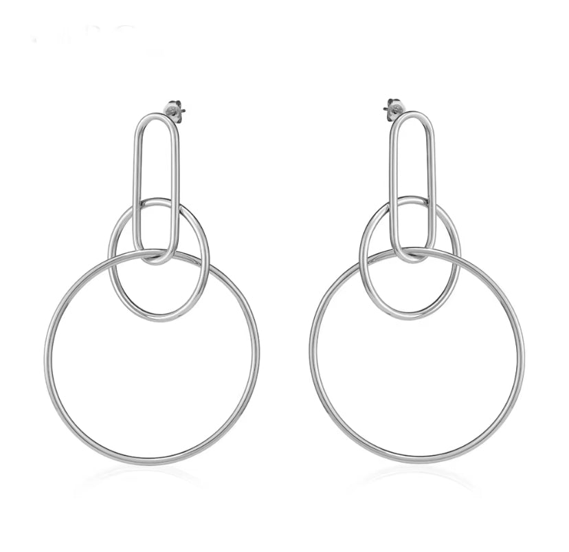 Silver interlocking oval link and large circle hoop drop earrings with stud backing, displayed on white background.