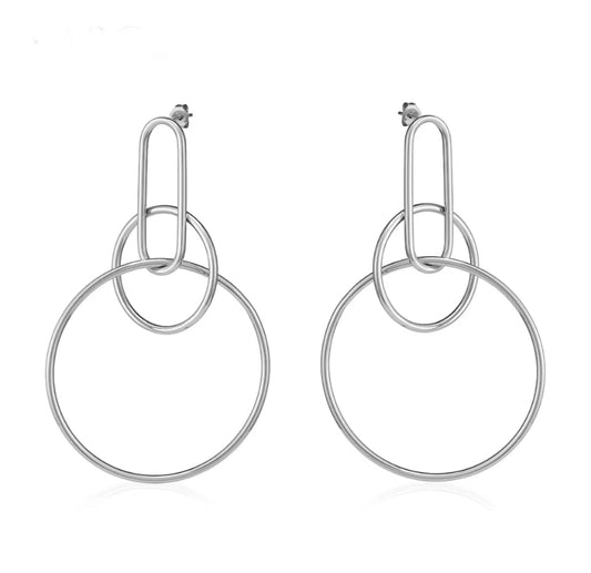 Silver interlocking oval link and large circle hoop drop earrings with stud backing, displayed on white background.