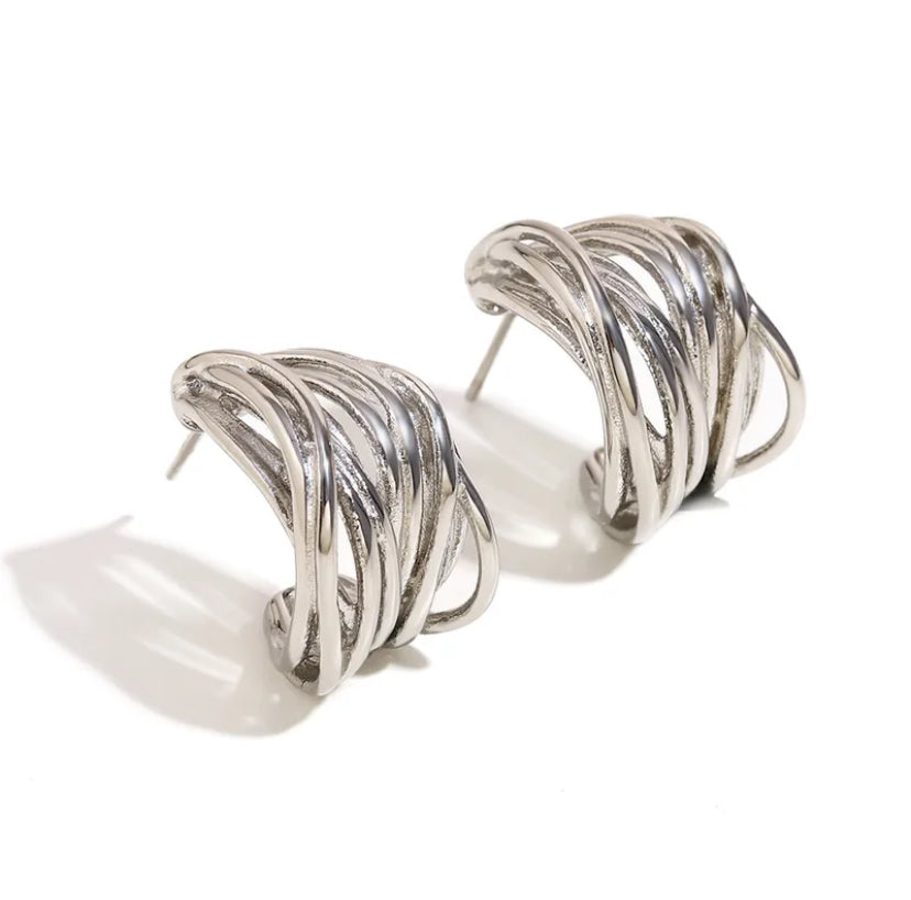 Chunky silver multi-strand woven hoop earrings shown from an angled front view on white background.
