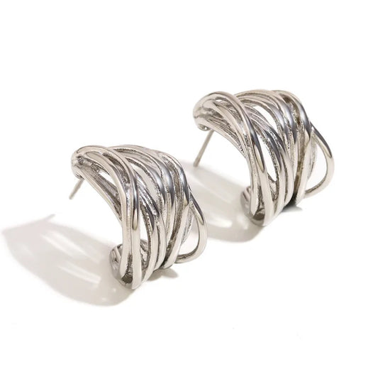 Chunky silver multi-strand woven hoop earrings shown from an angled front view on white background.