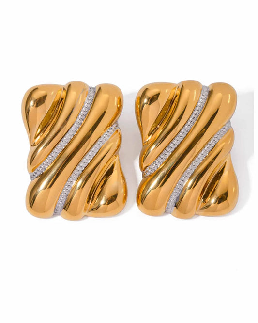 
Oversized chunky gold rectangle stud earrings with sculptural twisted ridges and diagonal crystal pave strips, displayed on white background.