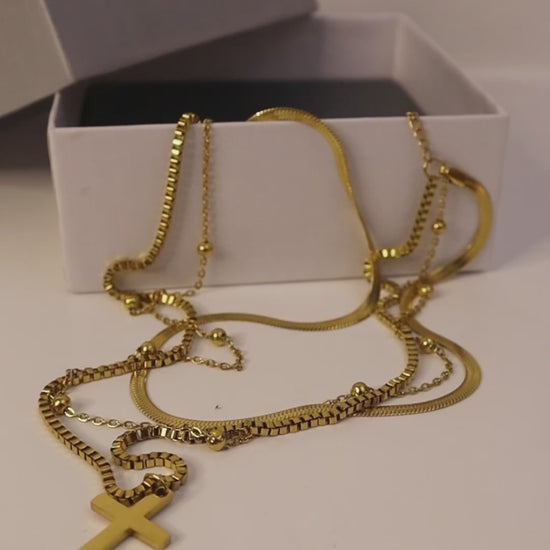 Dainty 14K Gold Necklace with a cross multilayer gold chain design – a perfect minimalist women’s gold necklace for effortless elegance and layering