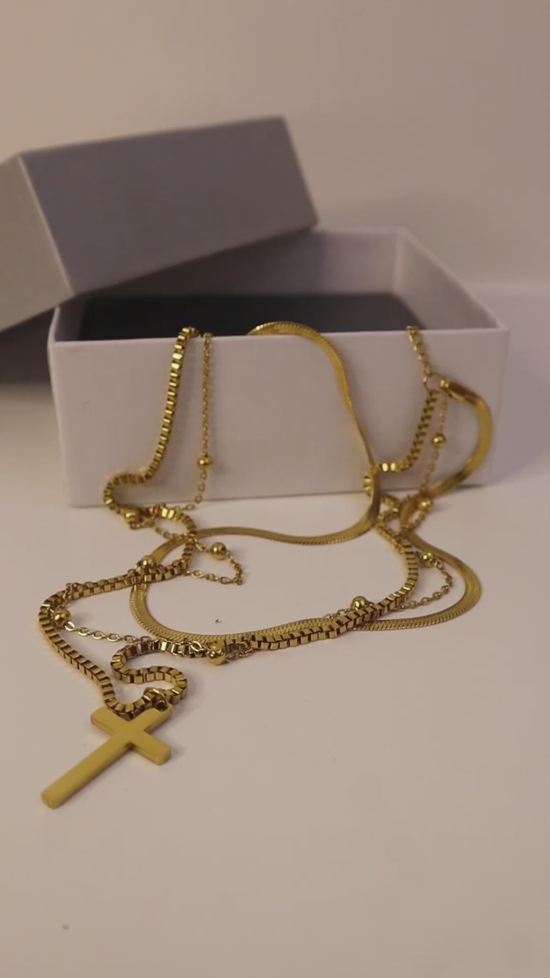 Dainty 14K Gold Necklace with a cross multilayer gold chain design – a perfect minimalist women’s gold necklace for effortless elegance and layering